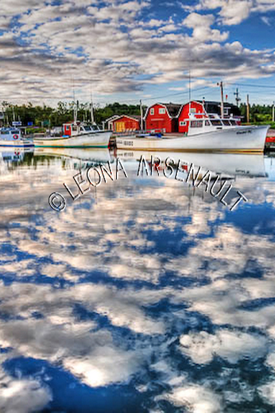 CANADA;PRINCE EDWARD ISLAND;QUEEN'S COUNTY;STANLEY BRIDGE;NAUTICAL;BOATS;FISHING BOATS;SHEDS;SHACKS;WATER;PIER;WHARF;HARBOUR;CLOUDS;SUMMER;REFLECTION;SEASCAPE;SCENIC;VERTICAL